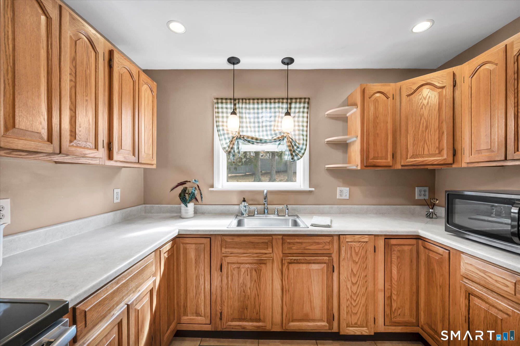 73 Sterling Hill Road Plainfield, CT 06354 - Photo 11 of 35 a kitchen with stainless steel appliances granite countertop a sink a cabinets and window