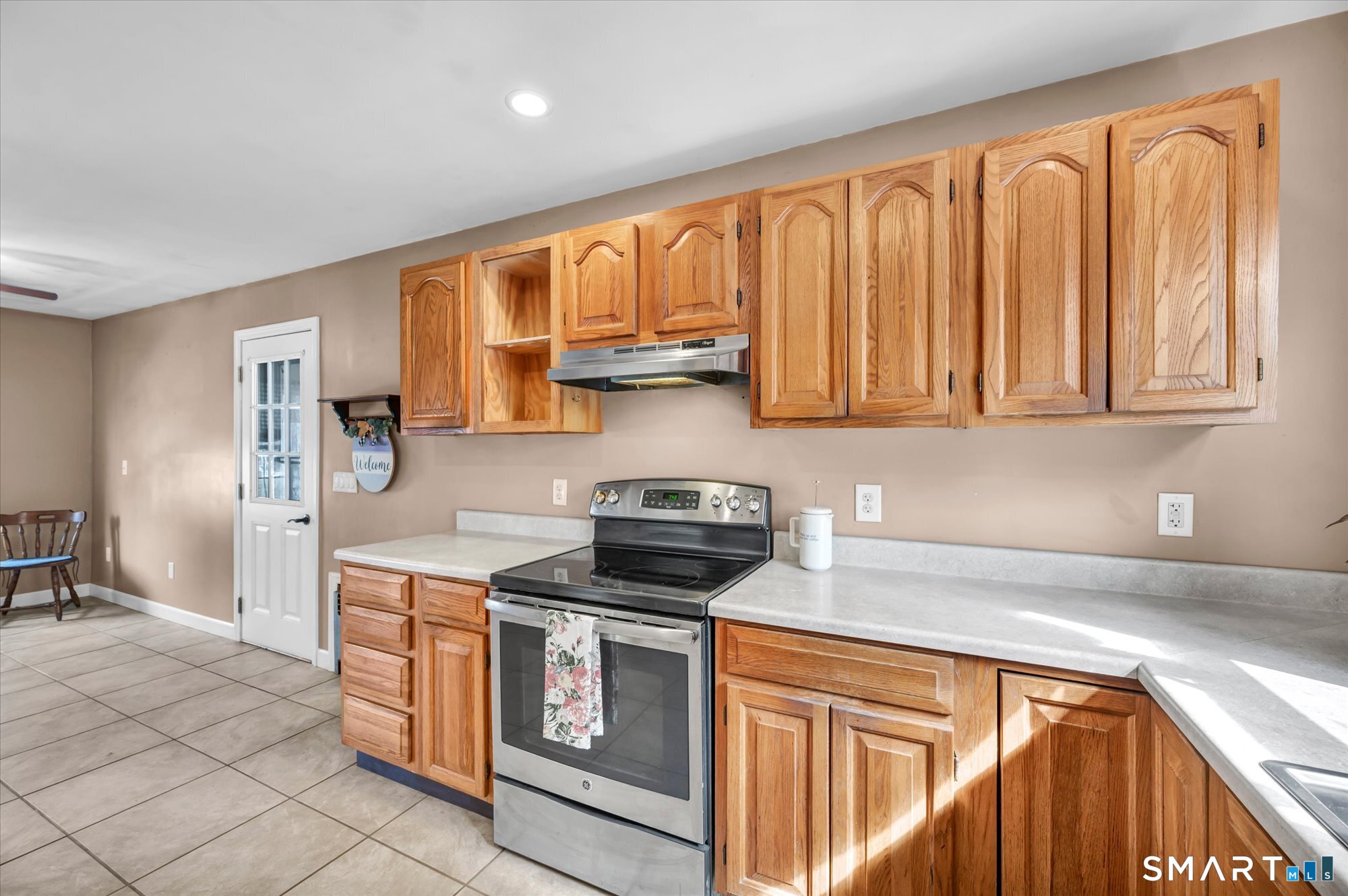 73 Sterling Hill Road Plainfield, CT 06354 - Photo 13 of 35 a kitchen with stainless steel appliances granite countertop a stove a sink and a microwave