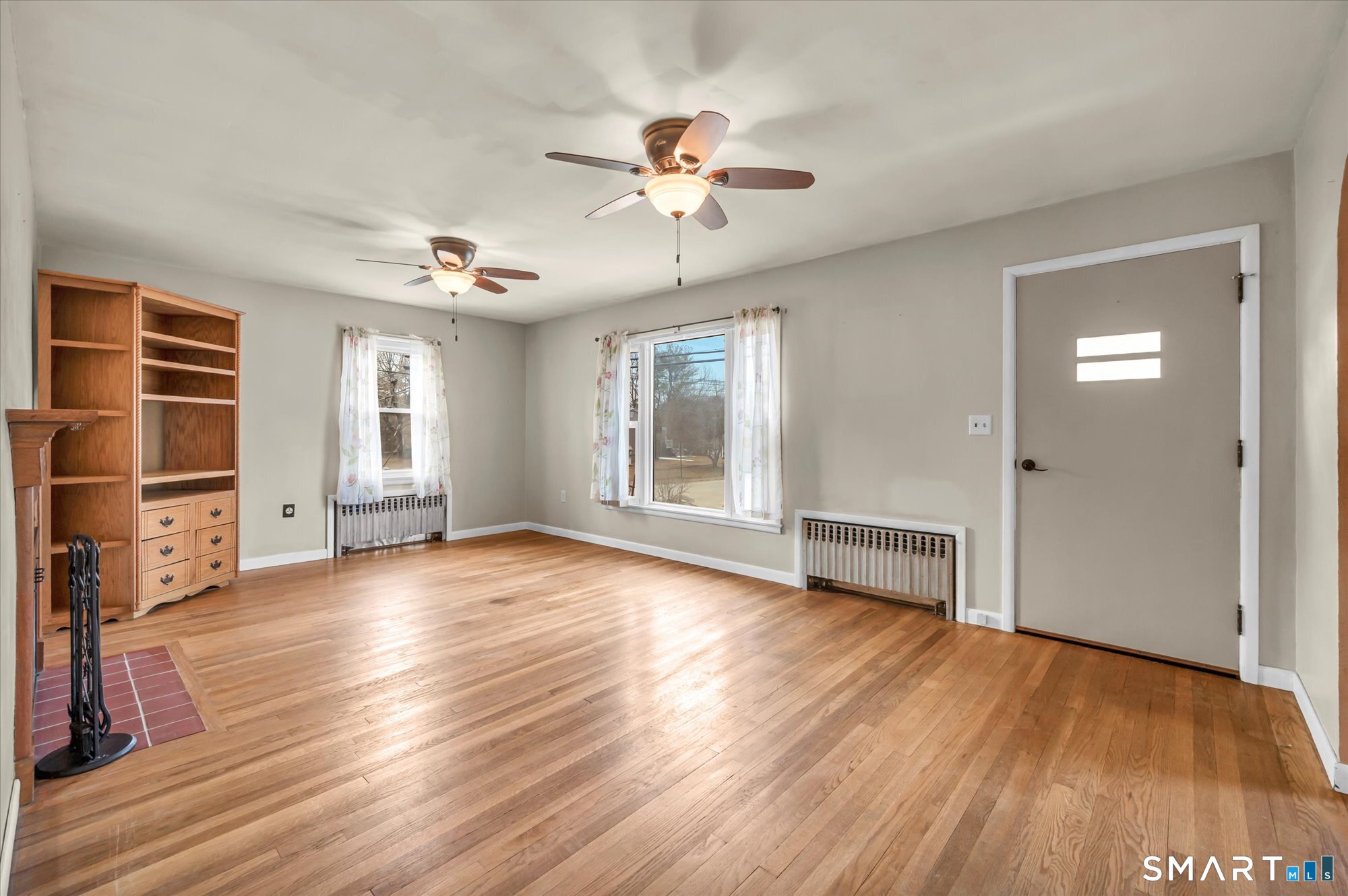 73 Sterling Hill Road Plainfield, CT 06354 - Photo 19 of 35 a view of an empty room with a window and wooden floor