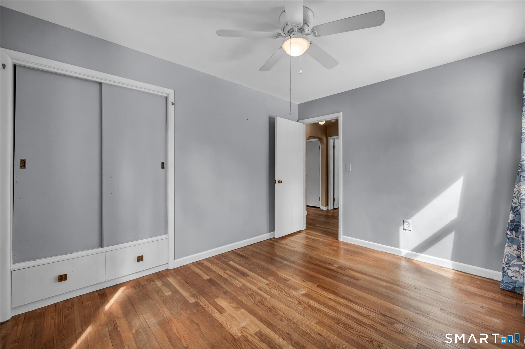 73 Sterling Hill Road Plainfield, CT 06354 - Photo 22 of 35 a view of an empty room with window and wooden floor