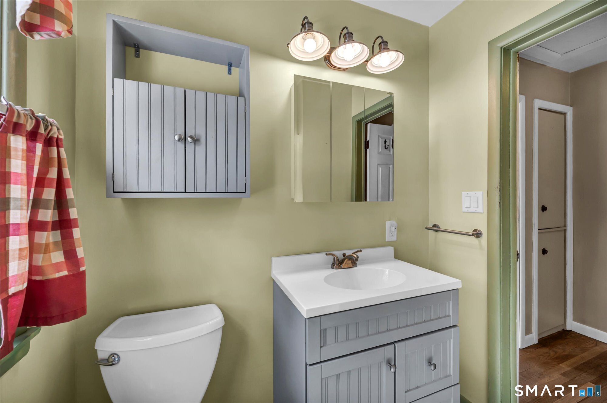 73 Sterling Hill Road Plainfield, CT 06354 - Photo 25 of 35 a bathroom with a toilet sink and mirror