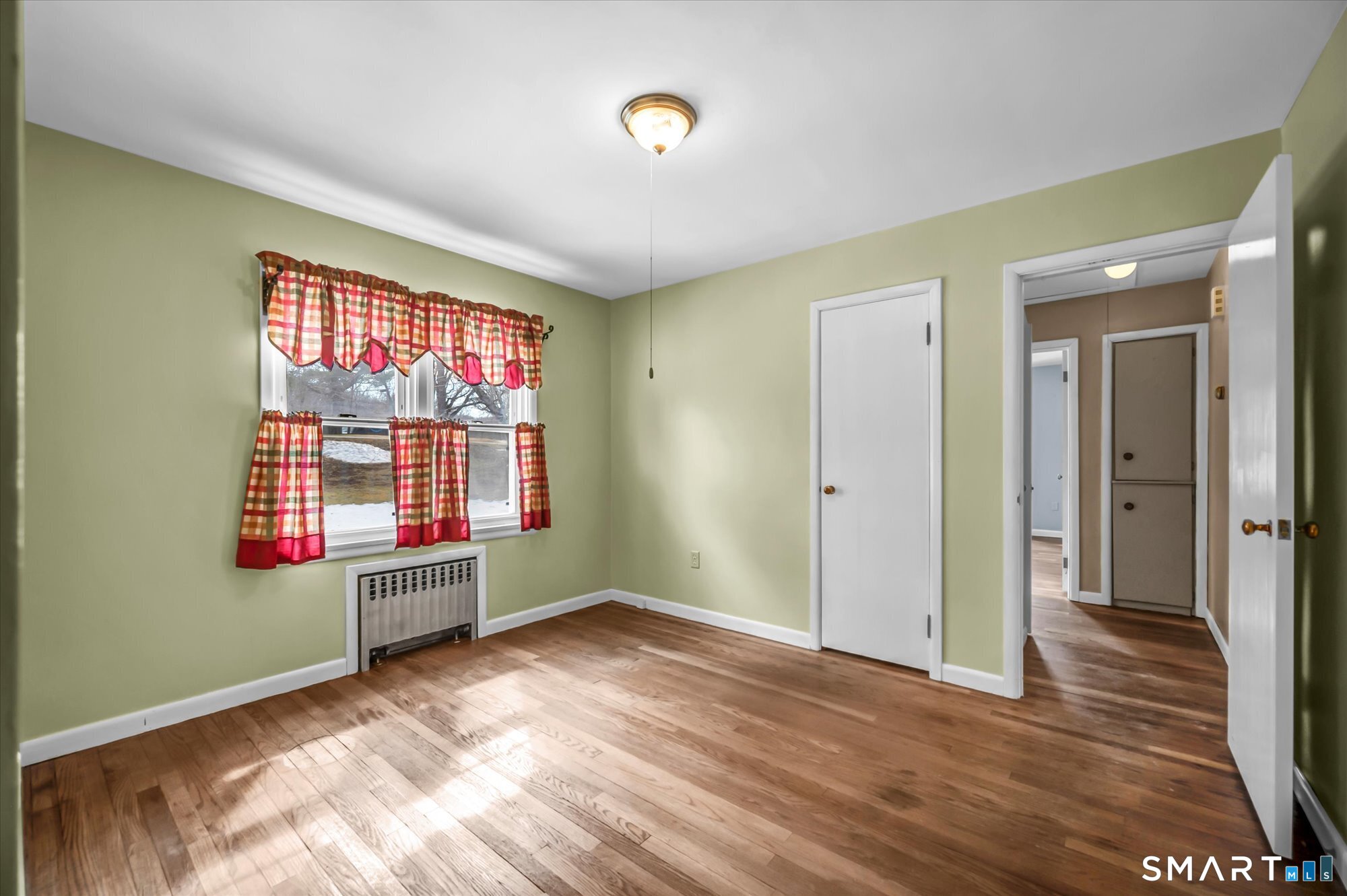 73 Sterling Hill Road Plainfield, CT 06354 - Photo 26 of 35 a view of an empty room with wooden floor and a window