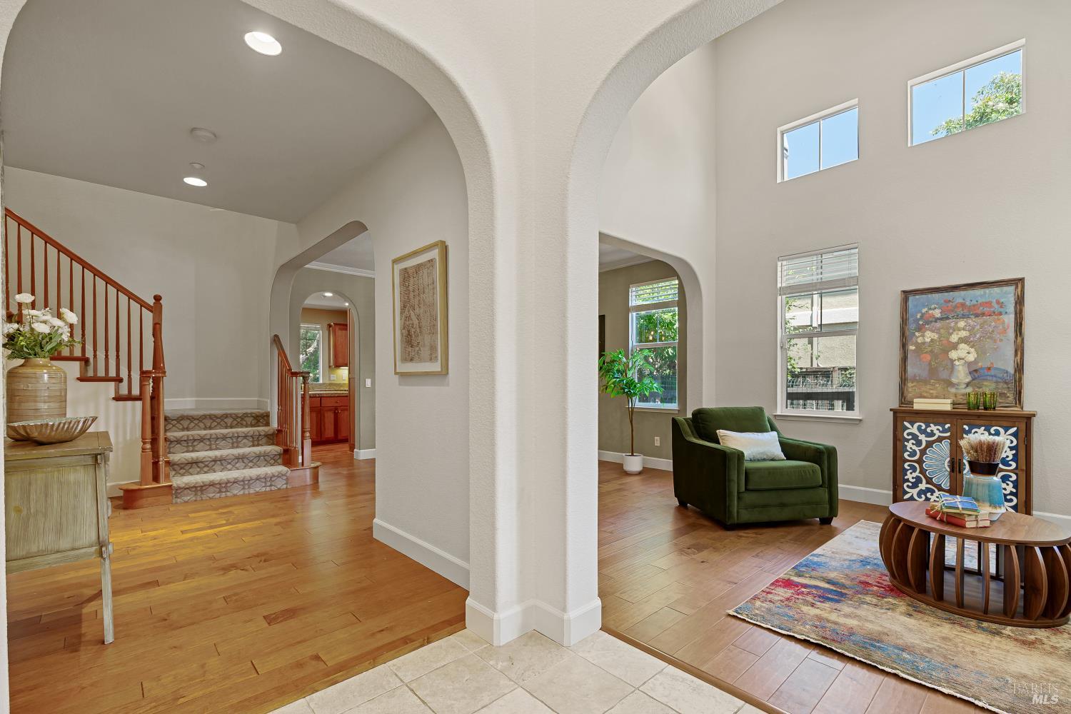 68 Pinheiro Circle Novato, CA 94945 - Photo 6 of 82 Step inside to soaring ceilings, graceful archways, and abundant natural light that make a memorable first impression. Recently installed engineered maple flooring adds warmth and elegance throughout the main living spaces