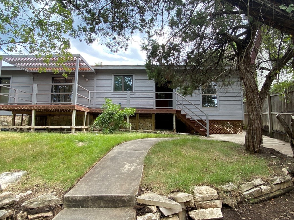 1516 Lisa Drive, Unit B Austin, TX 78733 - Photo 1 of 1 a front view of a house with a garden and yard