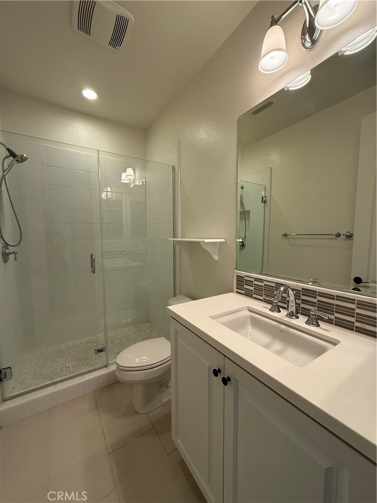 18 Meadow Place Tustin, CA 92782 - Photo 2 of 4 a bathroom with a sink a toilet and shower