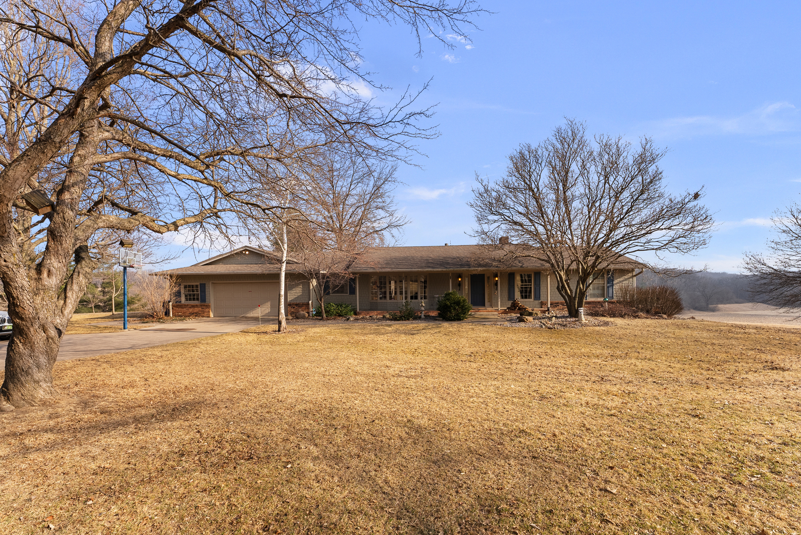 6026 95th Avenue West Taylor Ridge, IL 61284 - Photo 1 of 37 a yellow house with trees in front of it
