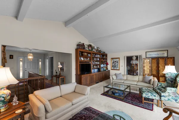 a living room with furniture and a large window