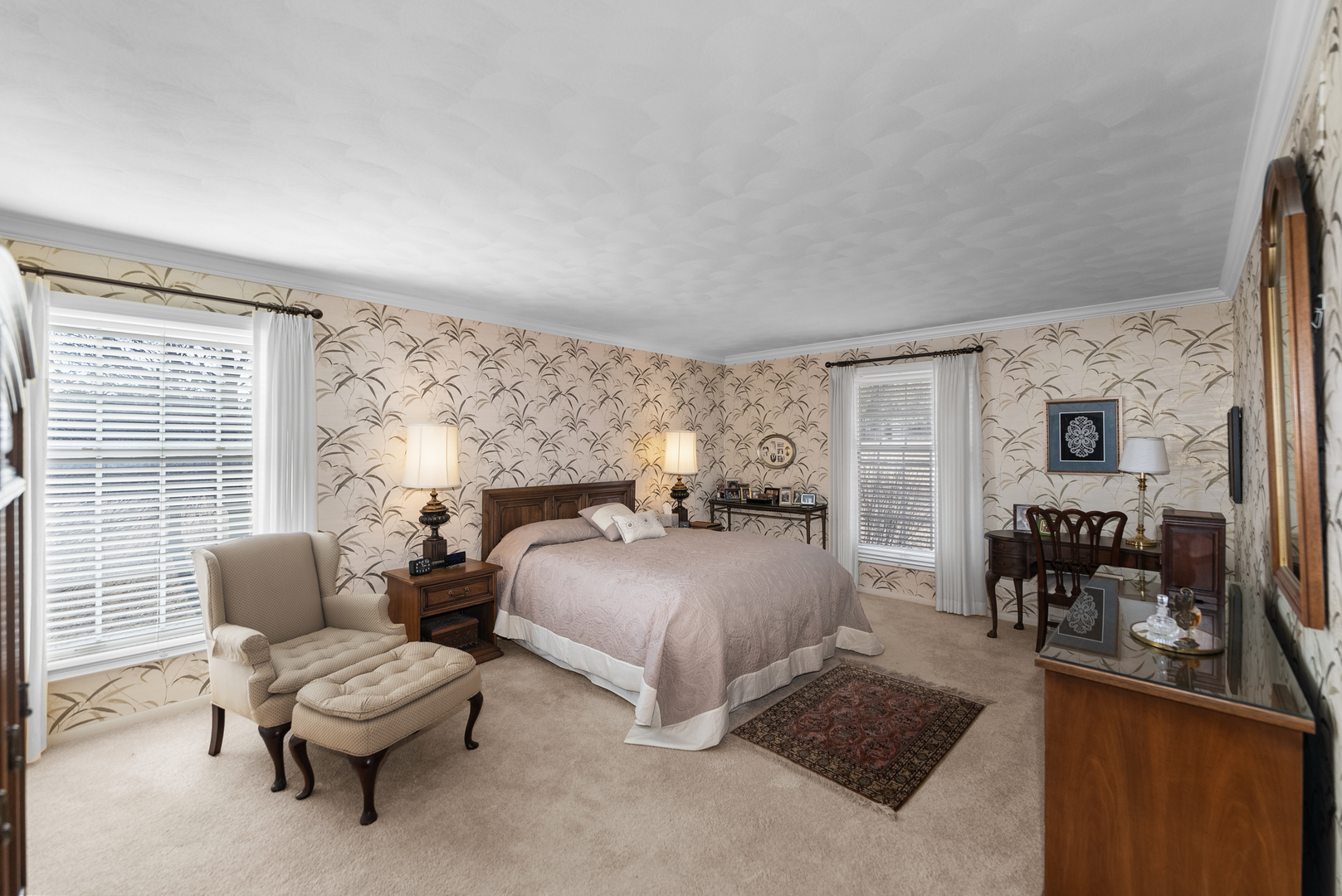 6026 95th Avenue West Taylor Ridge, IL 61284 - Photo 16 of 37 a spacious bedroom with a bed and a couch