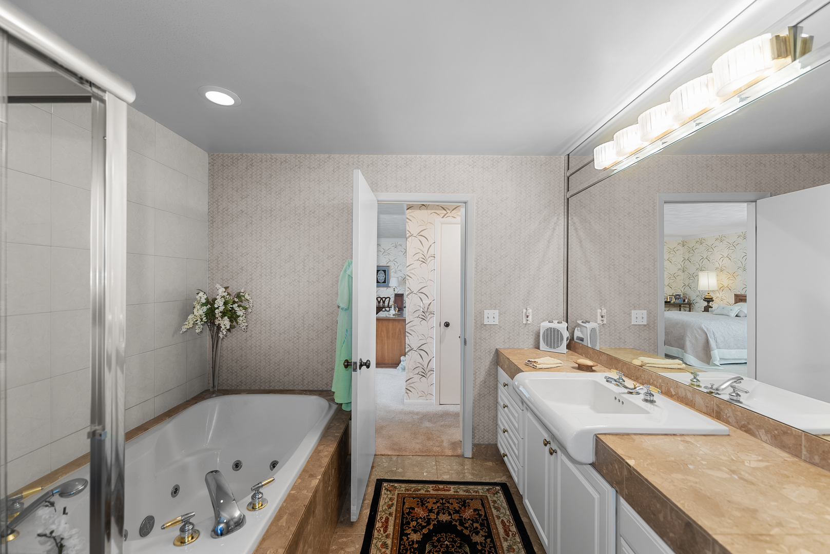 6026 95th Avenue West Taylor Ridge, IL 61284 - Photo 18 of 37 a bathroom with a tub sink and mirror