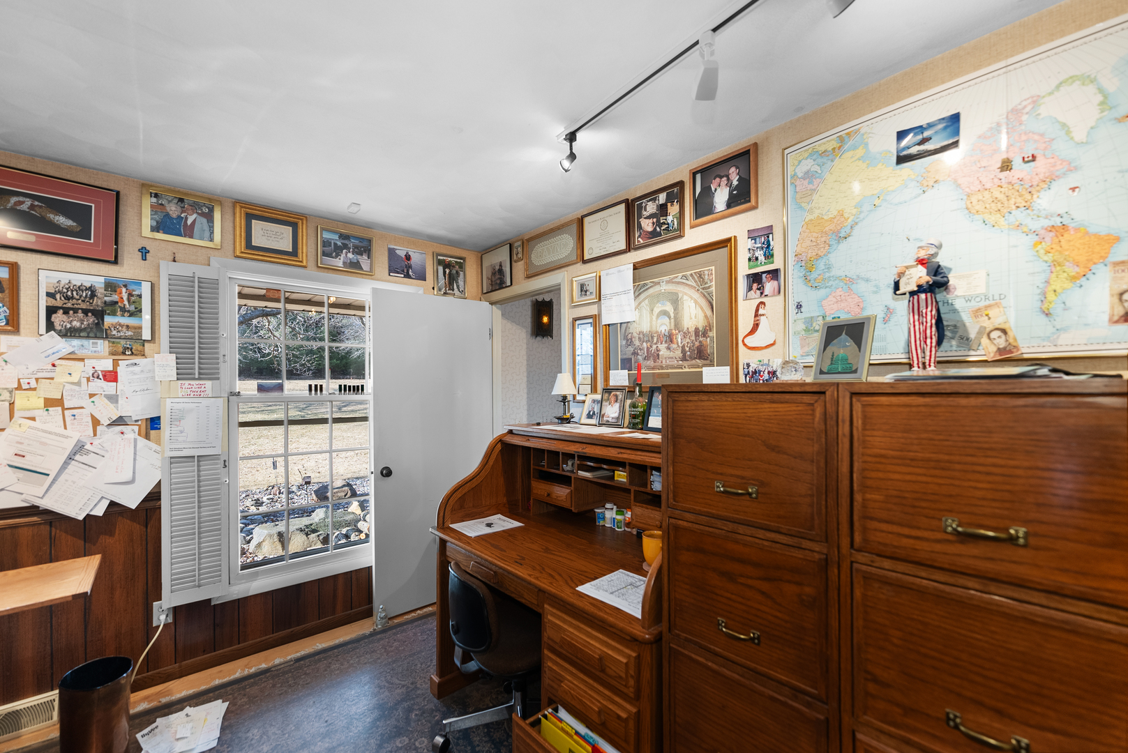 6026 95th Avenue West Taylor Ridge, IL 61284 - Photo 22 of 37 a view of a workspace with furniture and a window