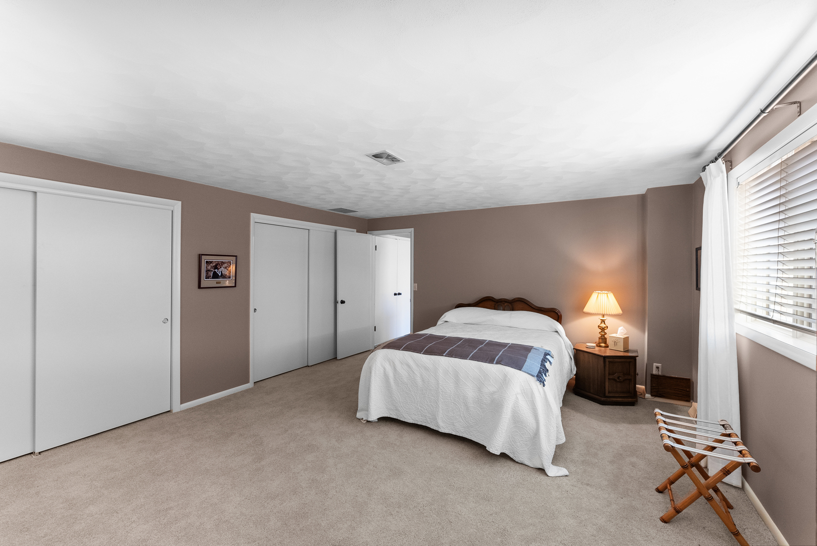 6026 95th Avenue West Taylor Ridge, IL 61284 - Photo 27 of 37 a bedroom with a bed and a table in it