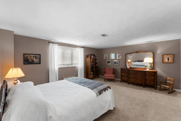 a bed room with a bed and furniture