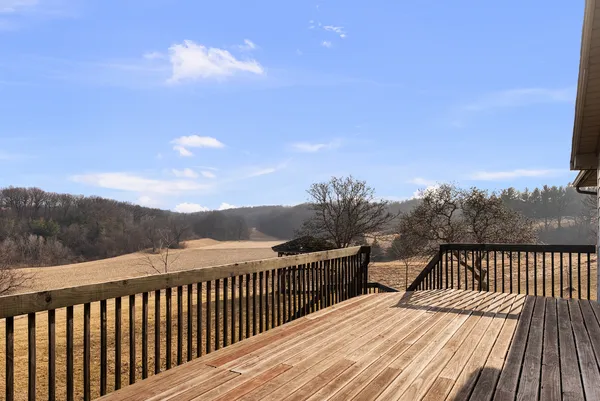 a view of balcony with wooden floor and city view