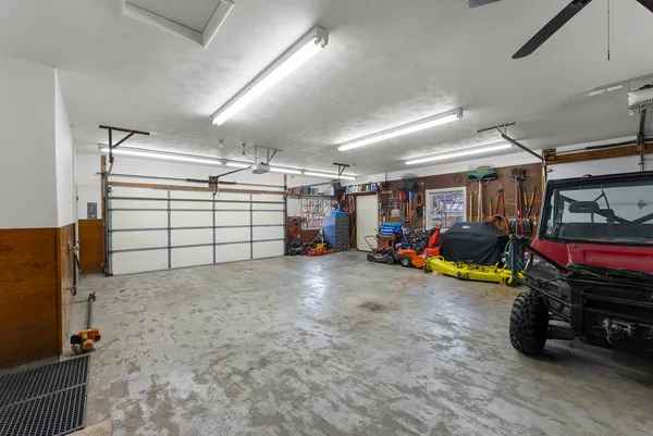 a view of a garage with parked cars