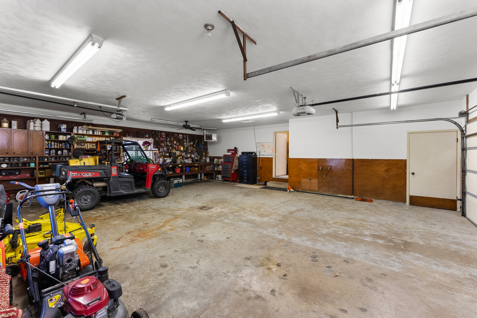 6026 95th Avenue West Taylor Ridge, IL 61284 - Photo 37 of 37 a view of a garage with a bike and car