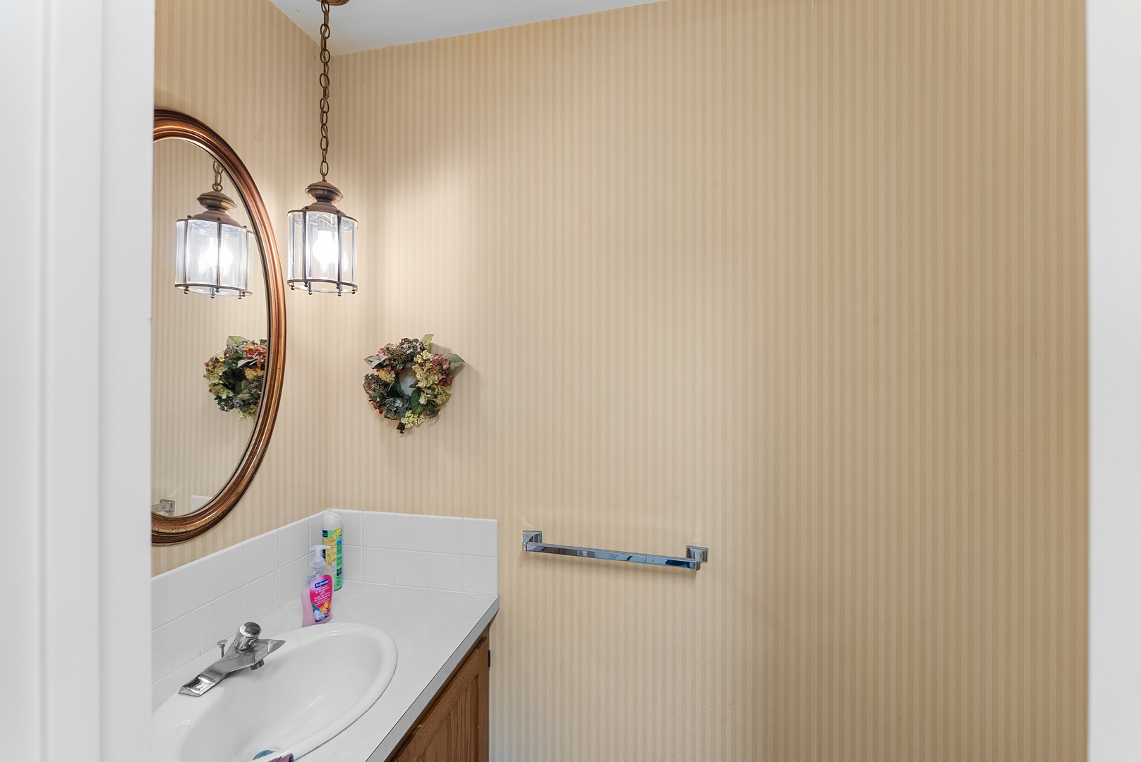 6026 95th Avenue West Taylor Ridge, IL 61284 - Photo 9 of 37 a bathroom with a sink mirror and vanity