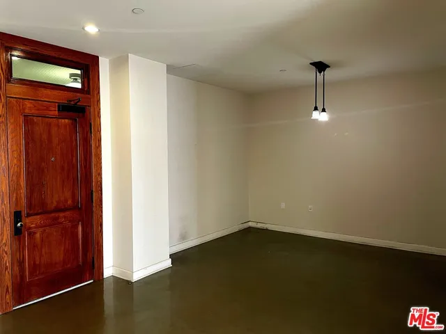 a view of an empty room and window