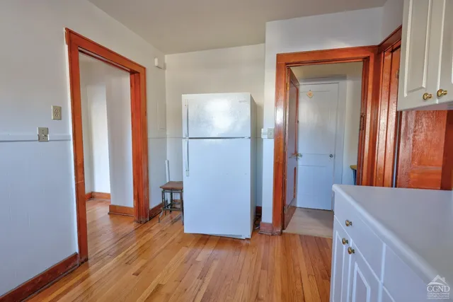 a kitchen with a stove and a cabinet