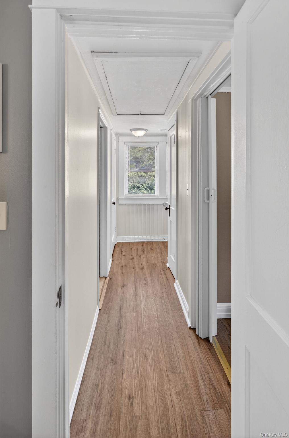 7 Walnut Street Poughkeepsie, NY 12601 - Photo 19 of 30 The upstairs hallway serves as a charming transition space, connecting the second-floor bedrooms while adding to the home's classic Cape Cod character.