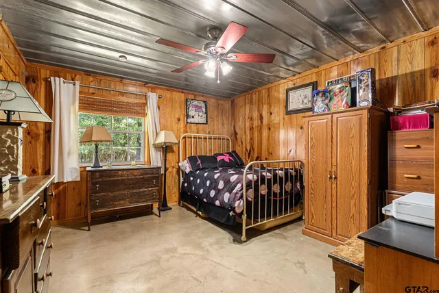 a bedroom with furniture and window