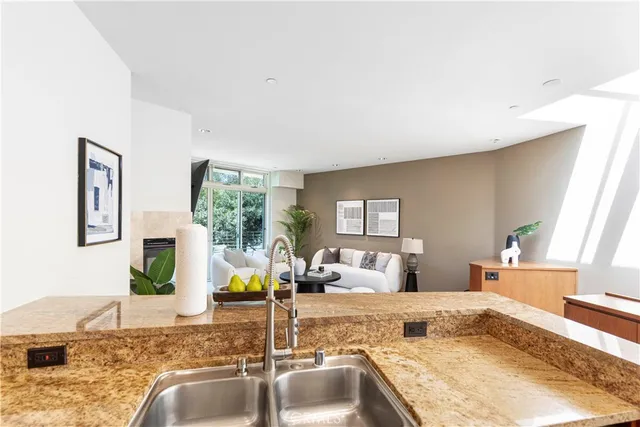 a living room with granite countertop furniture and fireplace