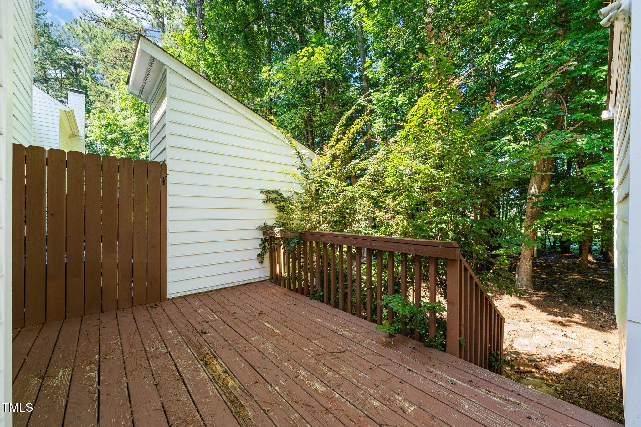 6051 Epping Forest Drive Raleigh, NC 27613 - Photo 13 of 26 a view of backyard with a deck and wooden floor