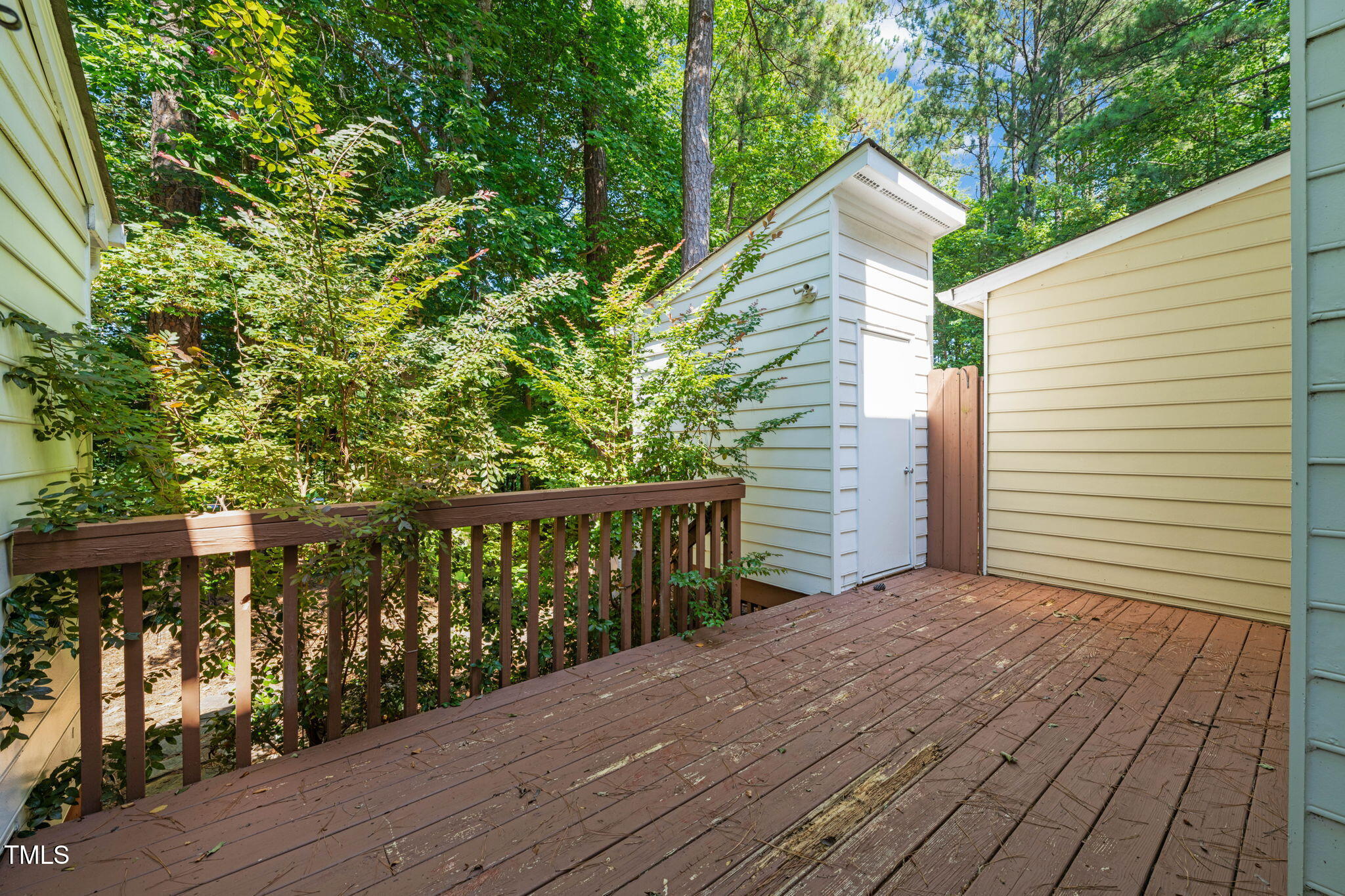6051 Epping Forest Drive Raleigh, NC 27613 - Photo 14 of 26 a view of a terrace with trees