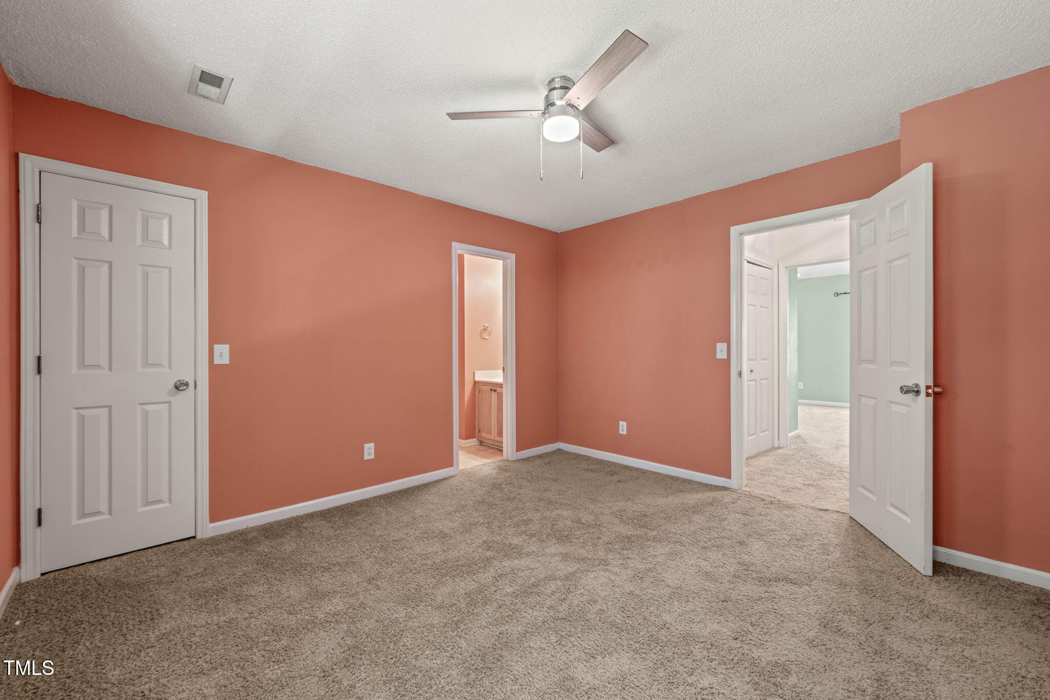 6051 Epping Forest Drive Raleigh, NC 27613 - Photo 25 of 26 a view of an empty room with a ceiling fan