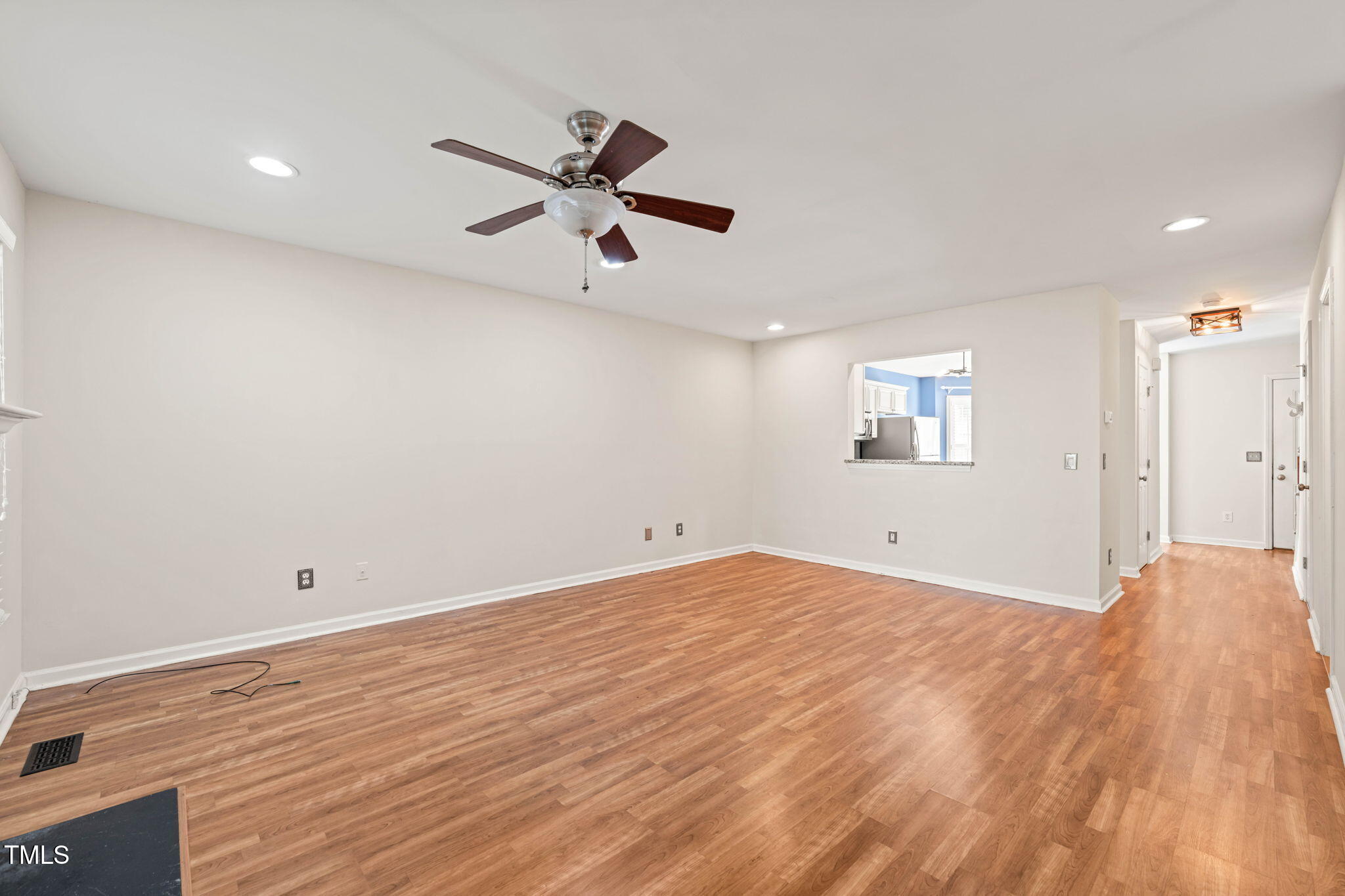6051 Epping Forest Drive Raleigh, NC 27613 - Photo 3 of 26 a view of a room with wooden floor closet and windows