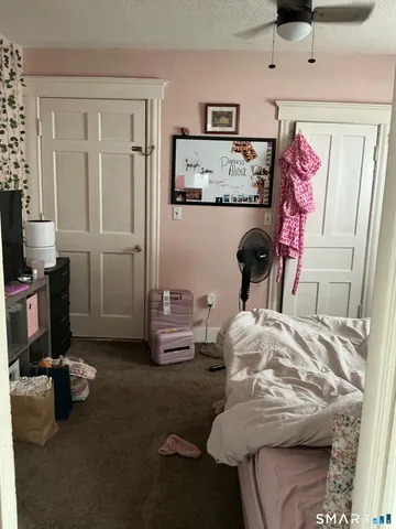 a bedroom with furniture and a bed