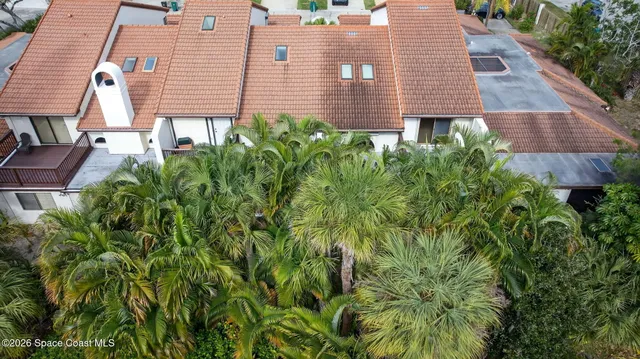 a dining room with furniture a chandelier and window