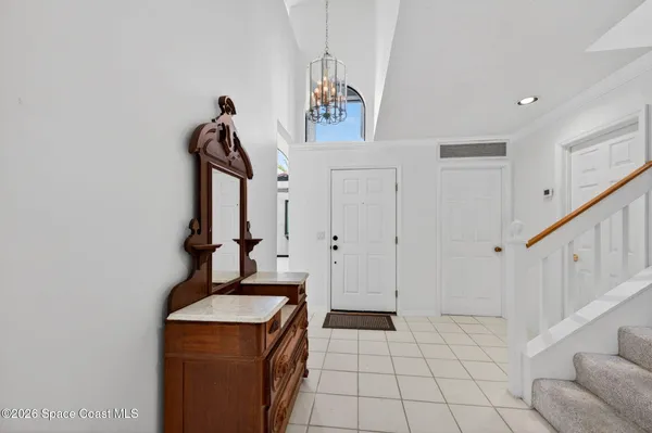 a kitchen with stainless steel appliances granite countertop a refrigerator stove microwave and sink