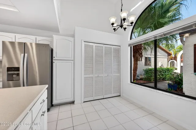 a view of a livingroom with a ceiling fan and window