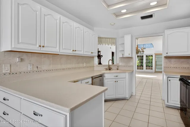 an empty room with wooden floor and window
