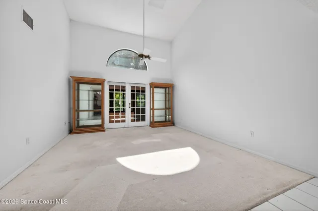a bathroom with a granite countertop sink mirror and toilet