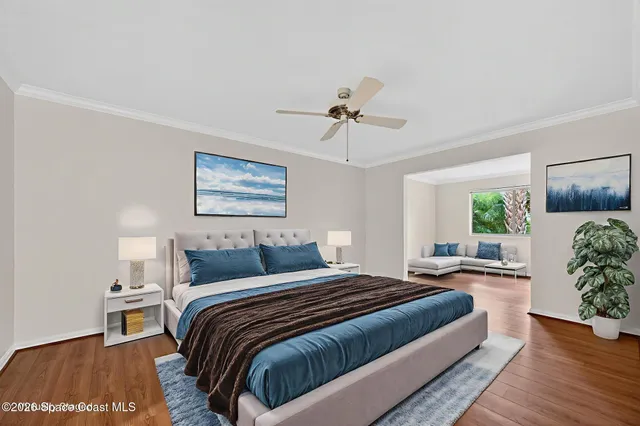 a living room with furniture a rug and a flat screen tv