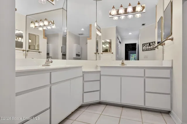 an empty room with a ceiling fan and a window