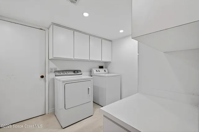 an empty room with a ceiling fan and a window