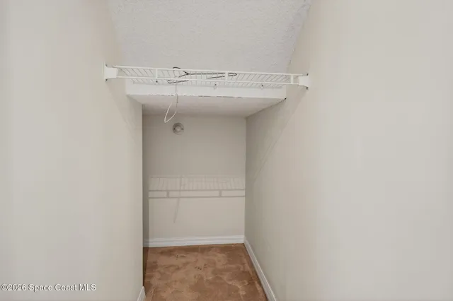 a view of a chair under an umbrella