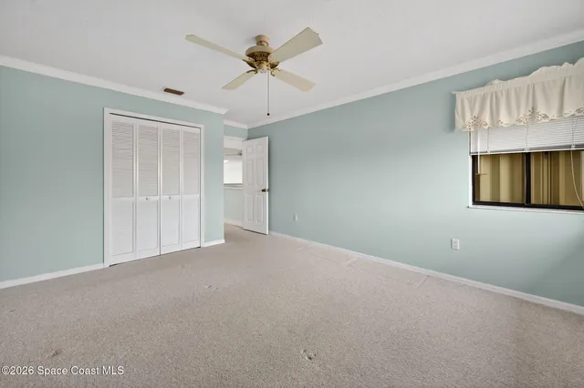 an aerial view of residential houses with outdoor space and lake view