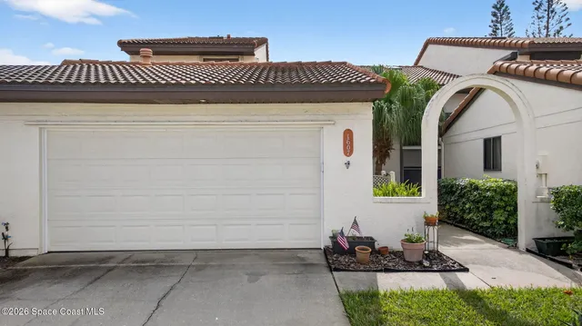an aerial view of residential houses with city view