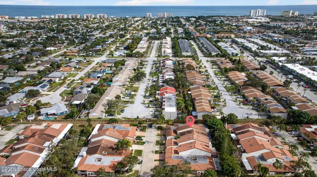 an aerial view of a house with a garden