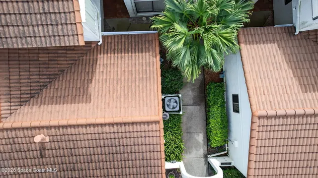 a kitchen with white cabinets and refrigerator