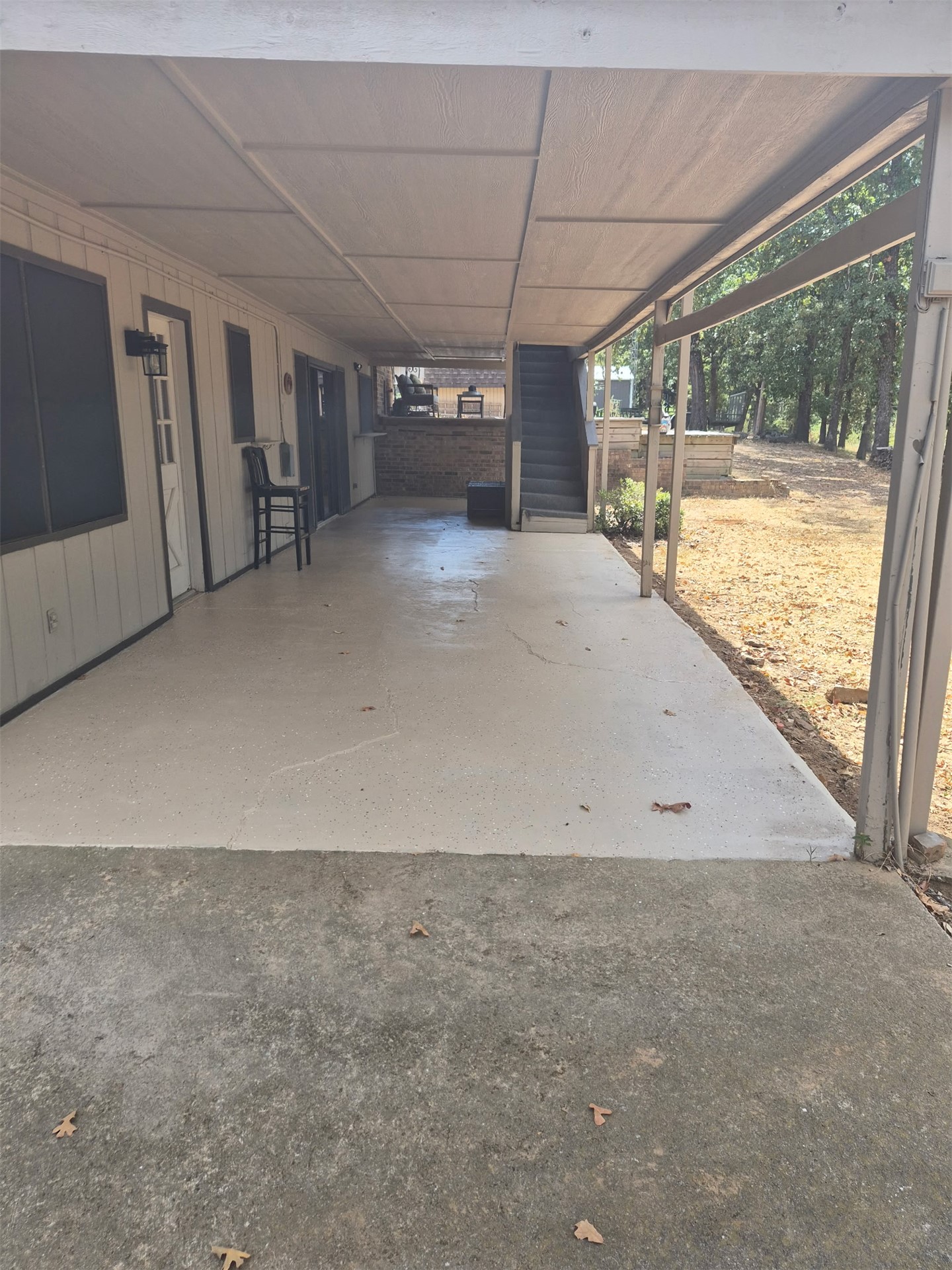 171 Woods Road Mead, OK 73449 - Photo 62 of 62 Covered outdoor living area featuring a concrete surface and direct exterior access