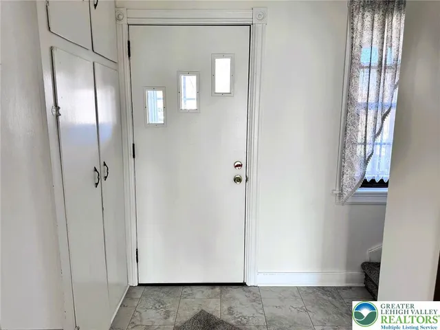 a bathroom with a bathtub sink and mirror