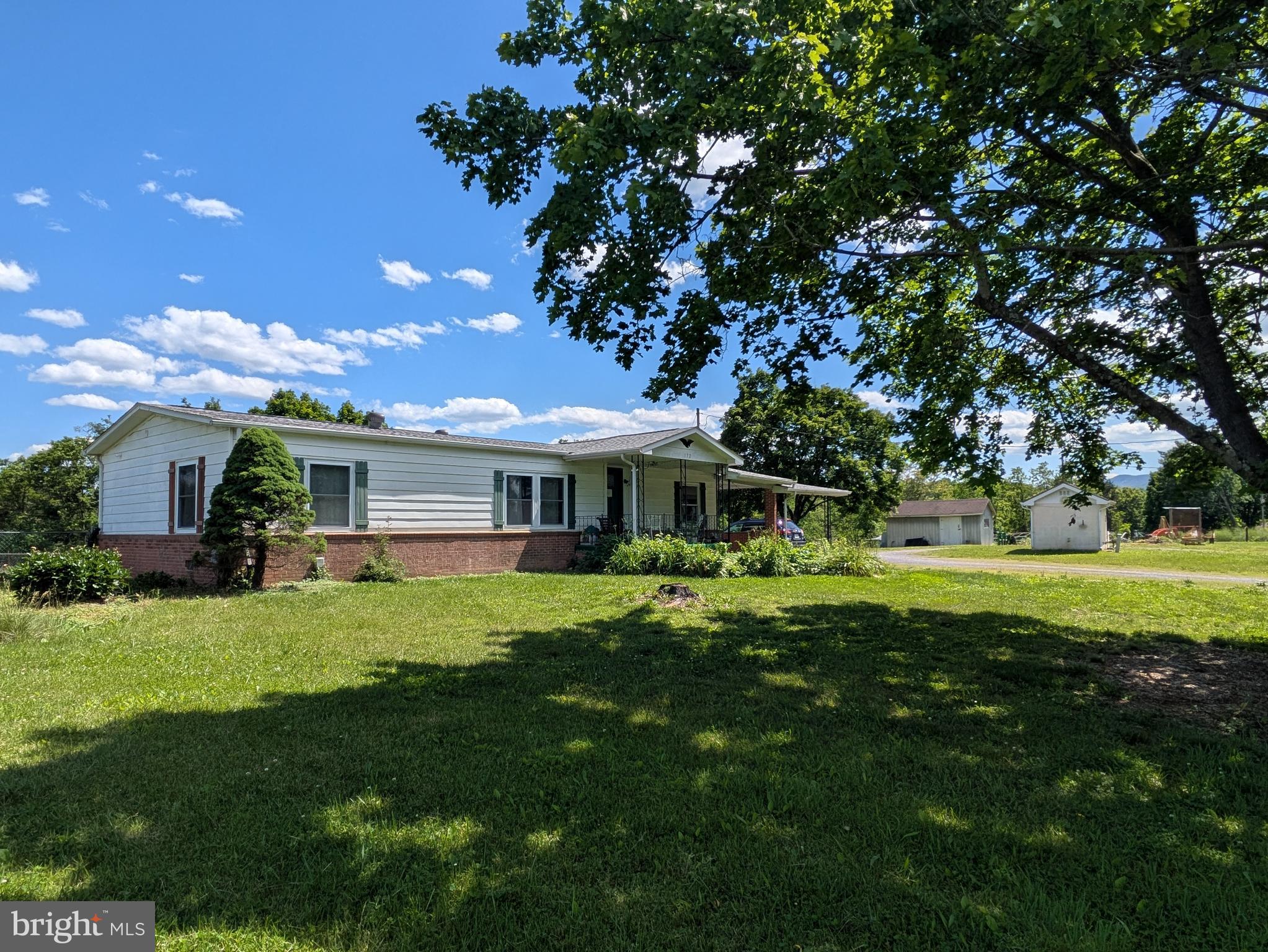 172 Rogers Mill Road Strasburg, VA 22657 - Photo 20 of 23 a front view of a house with garden