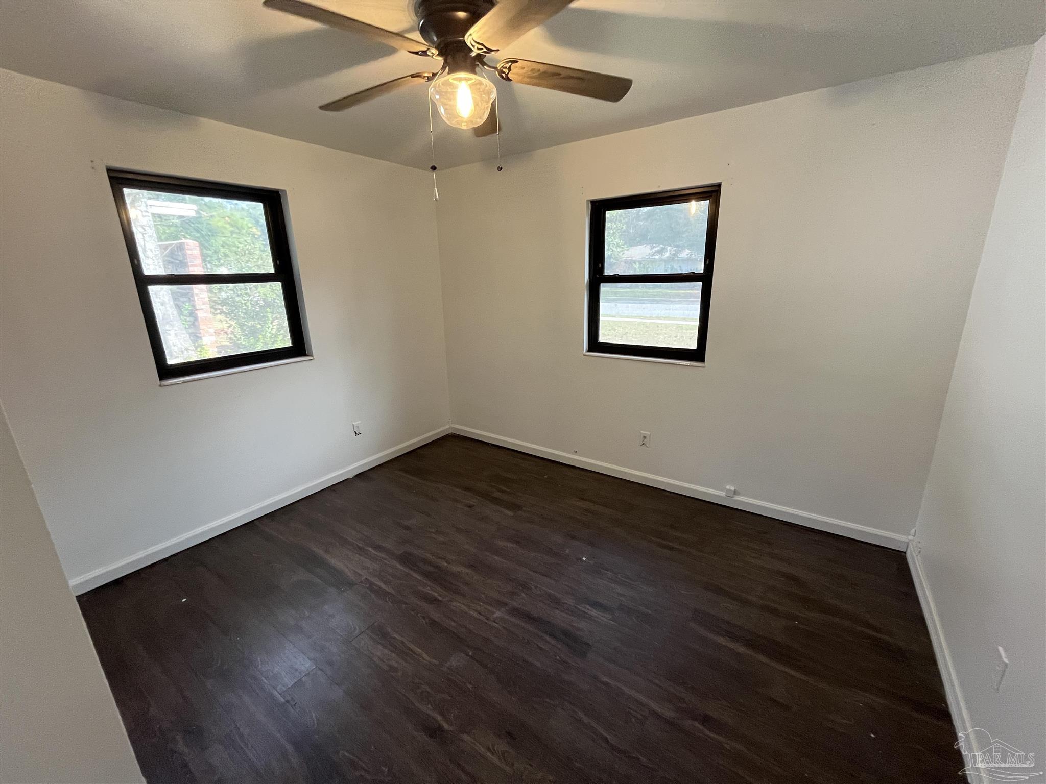 4511 St Nazaire Road Pensacola, FL 32505 - Photo 15 of 21 a view of an empty room with wooden floor and a window