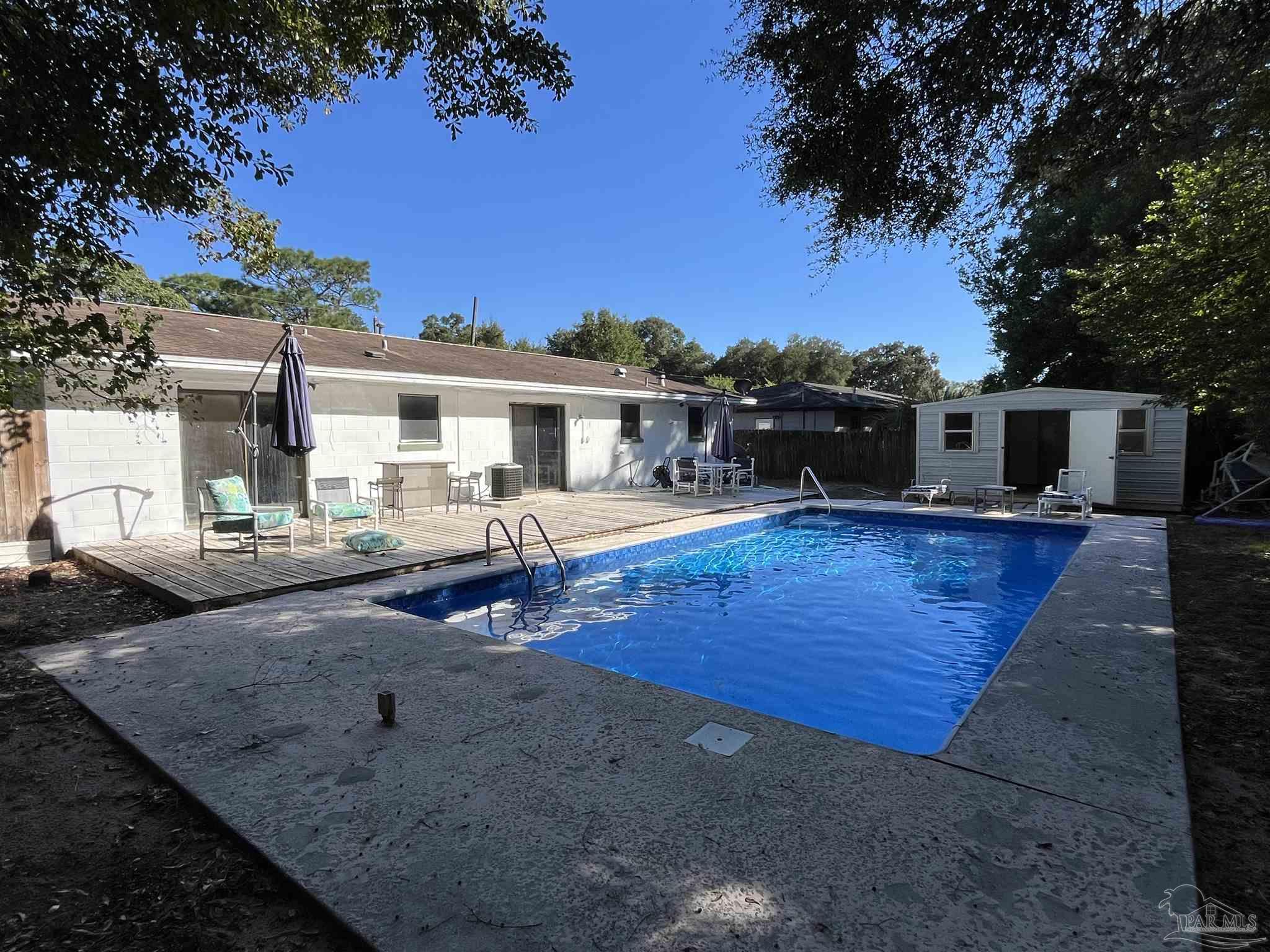 4511 St Nazaire Road Pensacola, FL 32505 - Photo 16 of 21 a view of a house with swimming pool