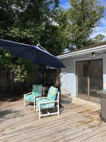 a backyard of a house with wooden floor yard barbeque oven and outdoor seating