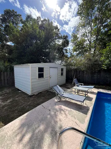 a view of a backyard with sitting area